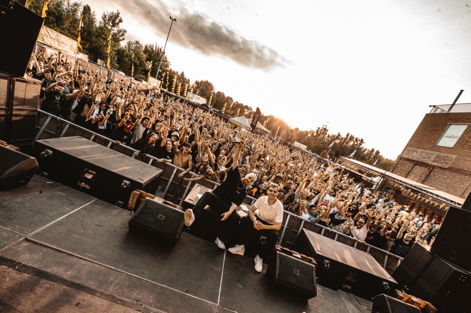 Open-air stage at sunset, packed crowd at Bad Habitz 2025