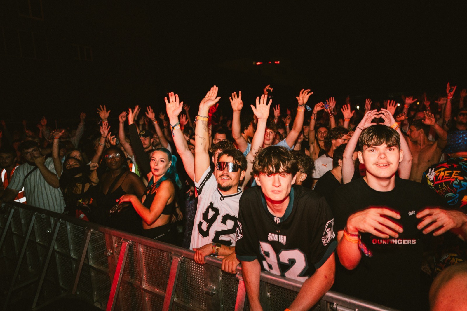 Indoor night crowd under red lights